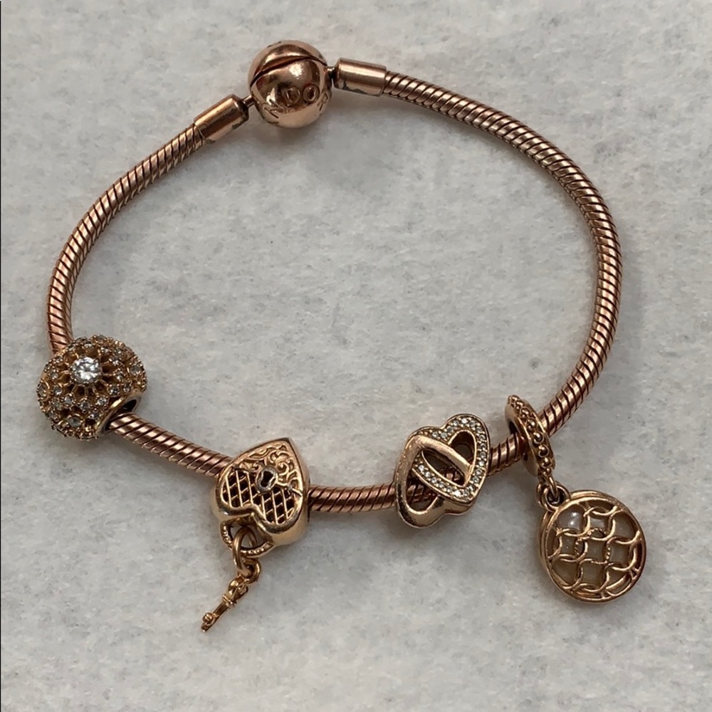 Rose gold Pandora bracelet and charms